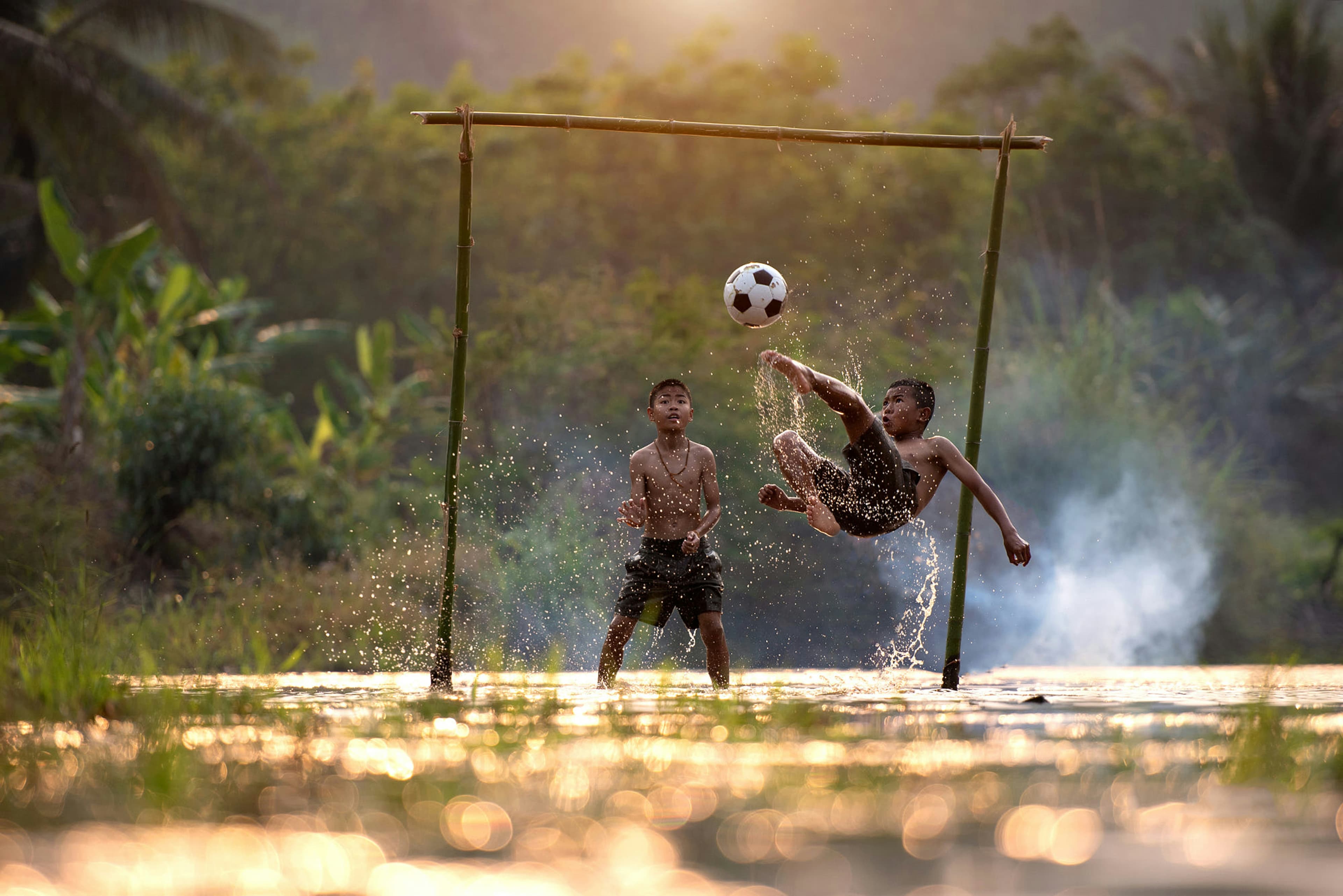 Soccer player on the pitch mid-play.